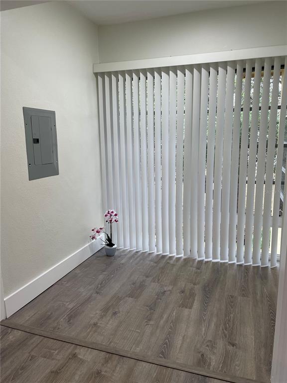 2003 Greenbriar Boulevard, Unit 16 Clearwater, FL 33763 - Photo 55 of 56 a view of an empty room with wooden floor