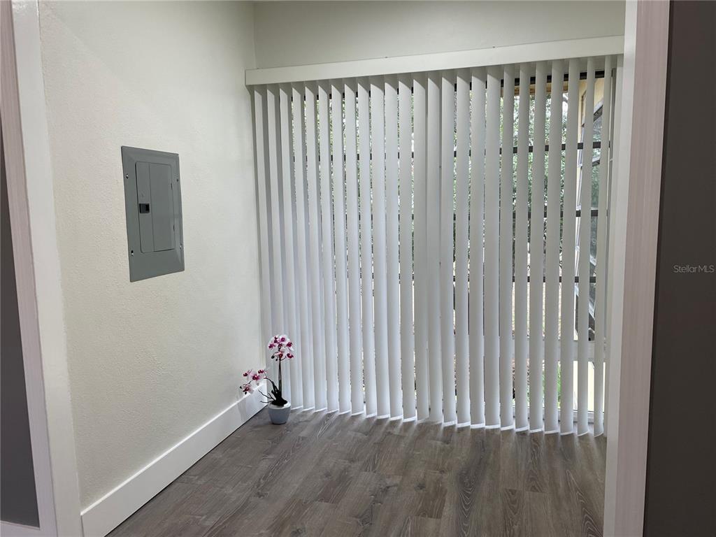 2003 Greenbriar Boulevard, Unit 16 Clearwater, FL 33763 - Photo 56 of 56 a view of a small space with wooden floor and a window