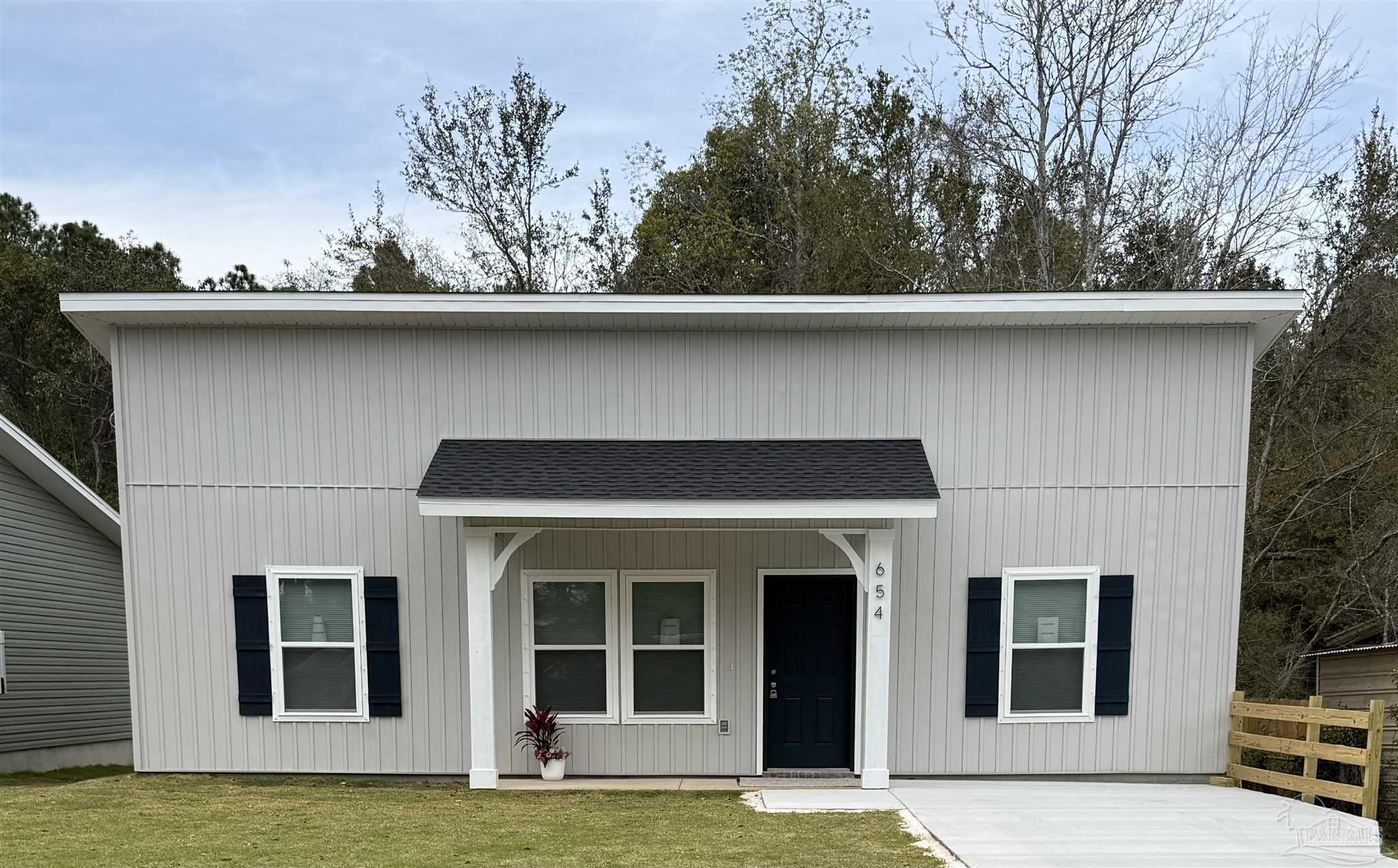 654 Nix Road Pensacola, FL 32506 - Photo 1 of 11 a house with a tree in the background
