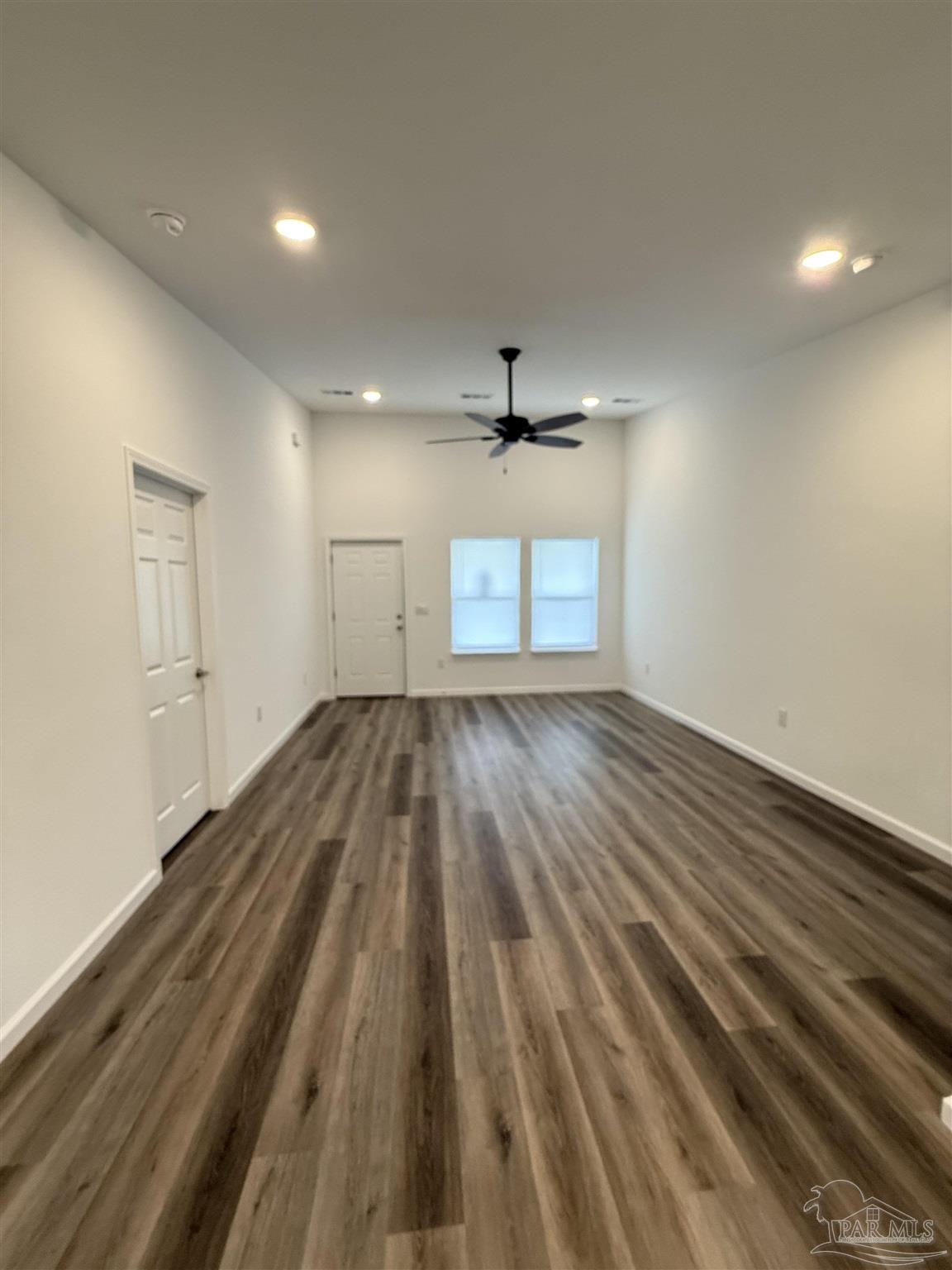 654 Nix Road Pensacola, FL 32506 - Photo 4 of 11 wooden floor in an empty room with a window
