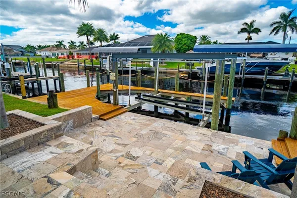 a view of a swimming pool with a patio