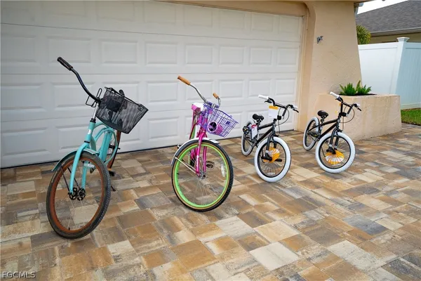 a view of bike storage next to a wooden cabinet