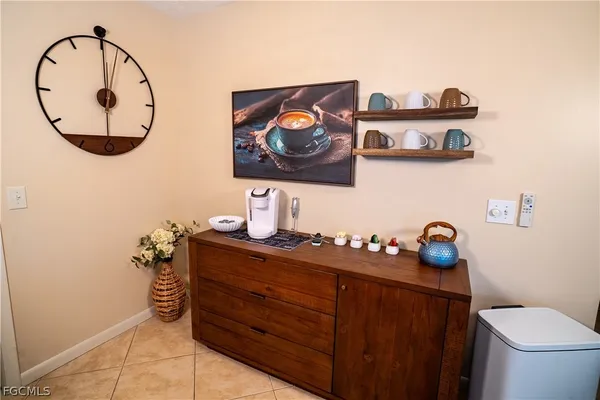 a bathroom with a toilet and a mirror