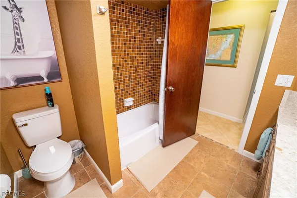 a bathroom with a toilet and a sink