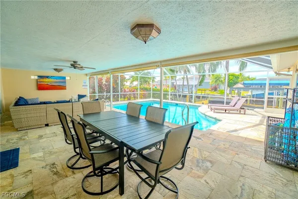 a view of a dining room with furniture window and outside view
