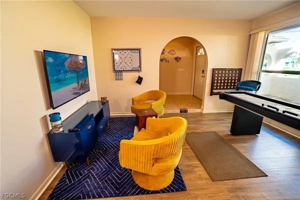 a living room with furniture and a window