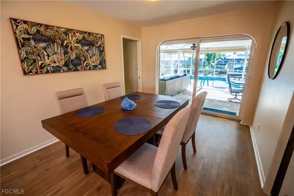 a view of a dining room with furniture and wooden floor