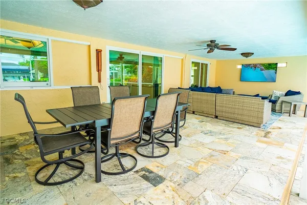 a view of a dining room with furniture wooden floor and a carpet