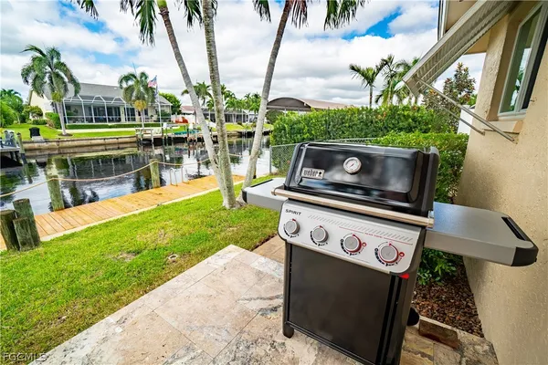a view of a chairs and table in the garden