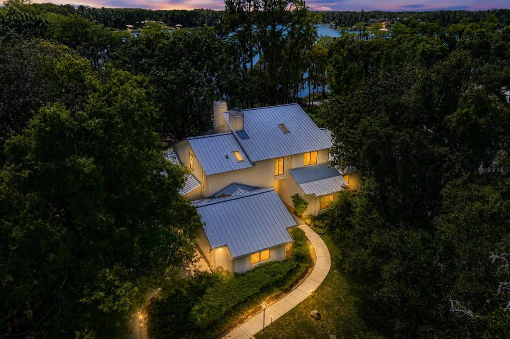 17810 Crawley Road Odessa, FL 33556 - Photo 67 of 76 an aerial view of a house with a yard and garden view