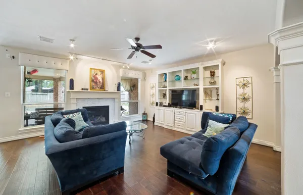 a living room with furniture and a fireplace
