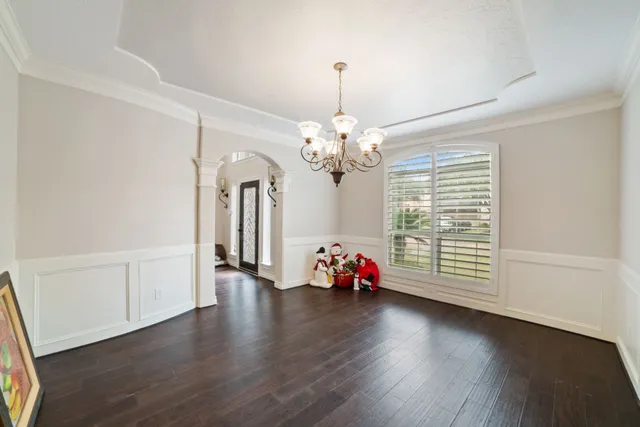 a kitchen with kitchen island granite countertop a sink stainless steel appliances and white cabinets