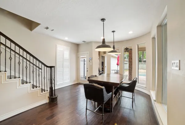 a view of a dining room with furniture window and wooden floor