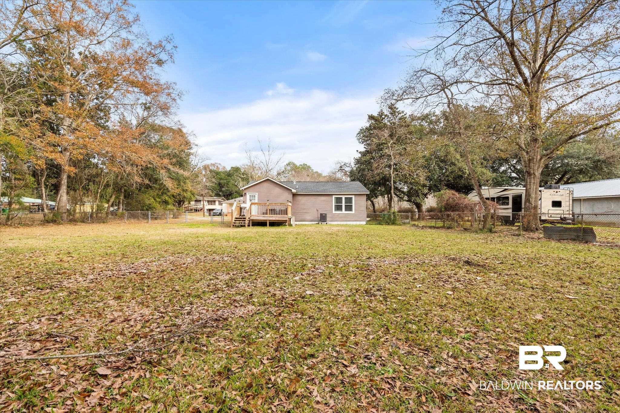 419 Pierce Street Saraland, AL 36571 - Photo 18 of 21 View of yard with a deck