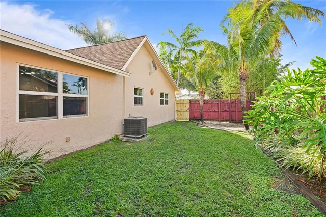 a view of a backyard with a small cabin