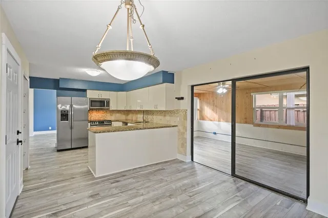 a view of a room with a large window