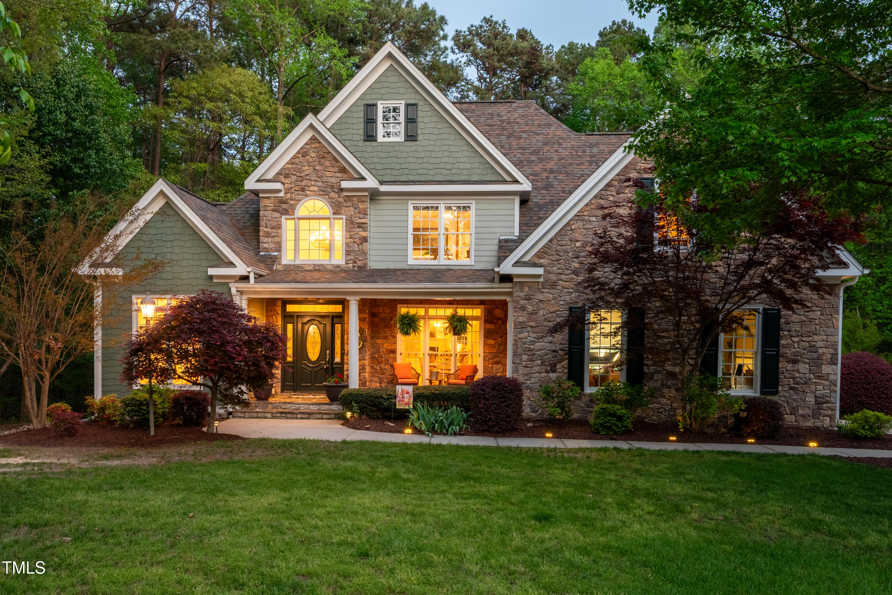 8480 Falkirk Ridge Court Wake Forest, NC 27587 - Photo 1 of 63 a front view of a house with a yard