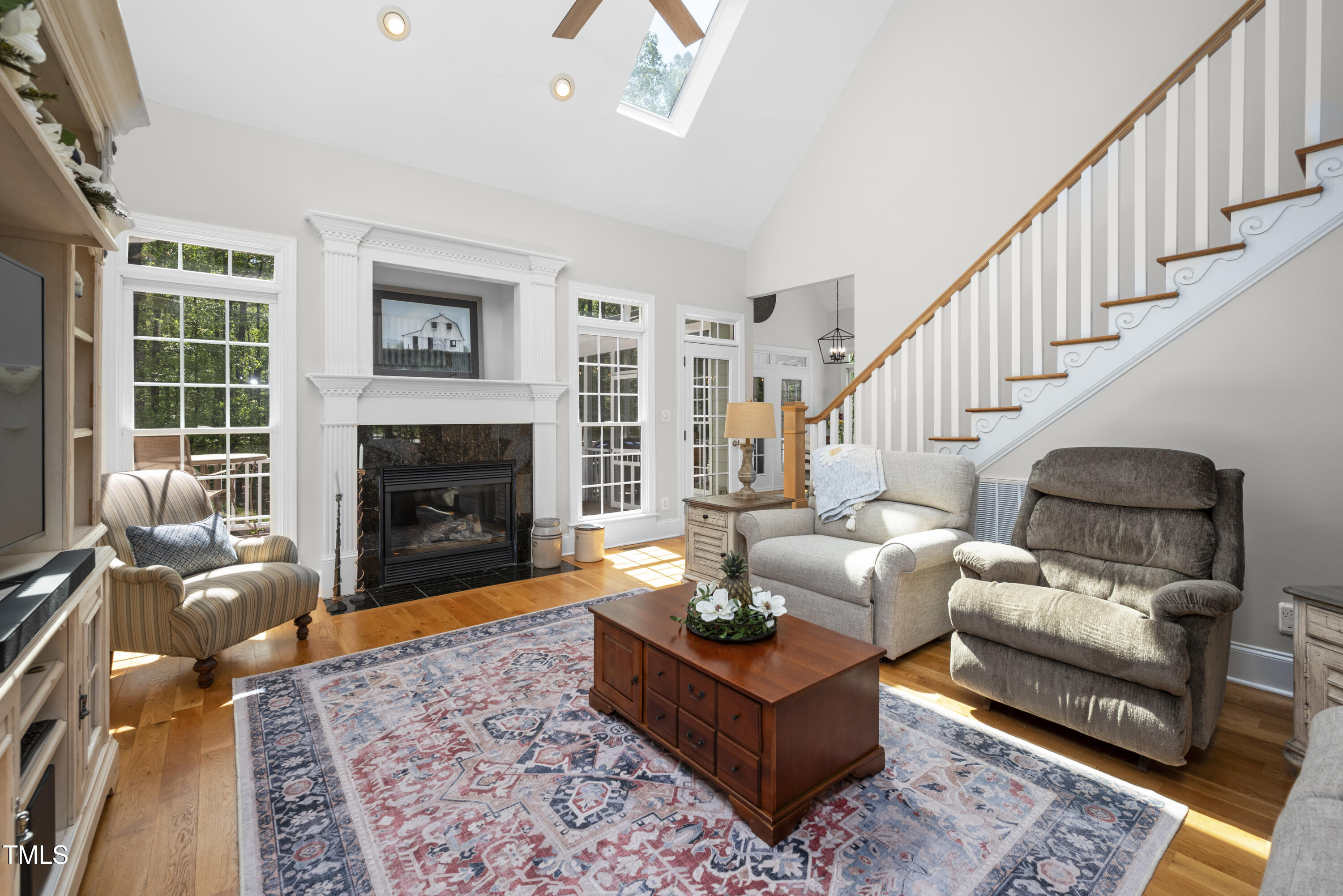 8480 Falkirk Ridge Court Wake Forest, NC 27587 - Photo 15 of 63 a living room with furniture and a fireplace