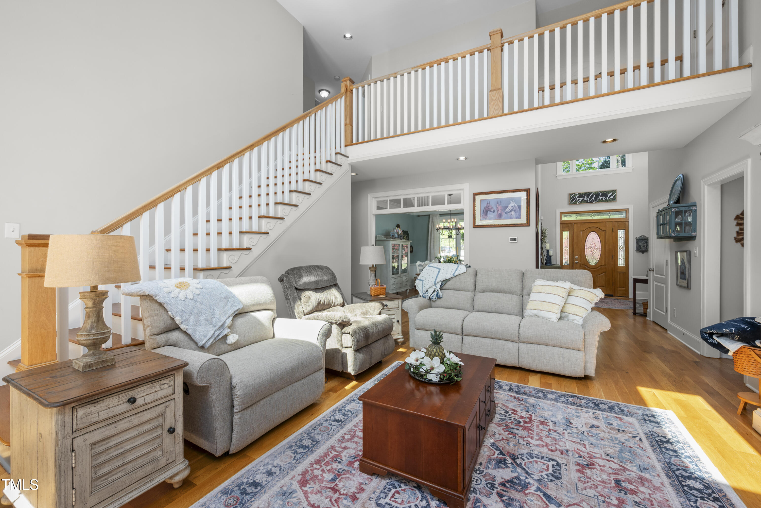 8480 Falkirk Ridge Court Wake Forest, NC 27587 - Photo 16 of 63 a living room with furniture rug and a rug