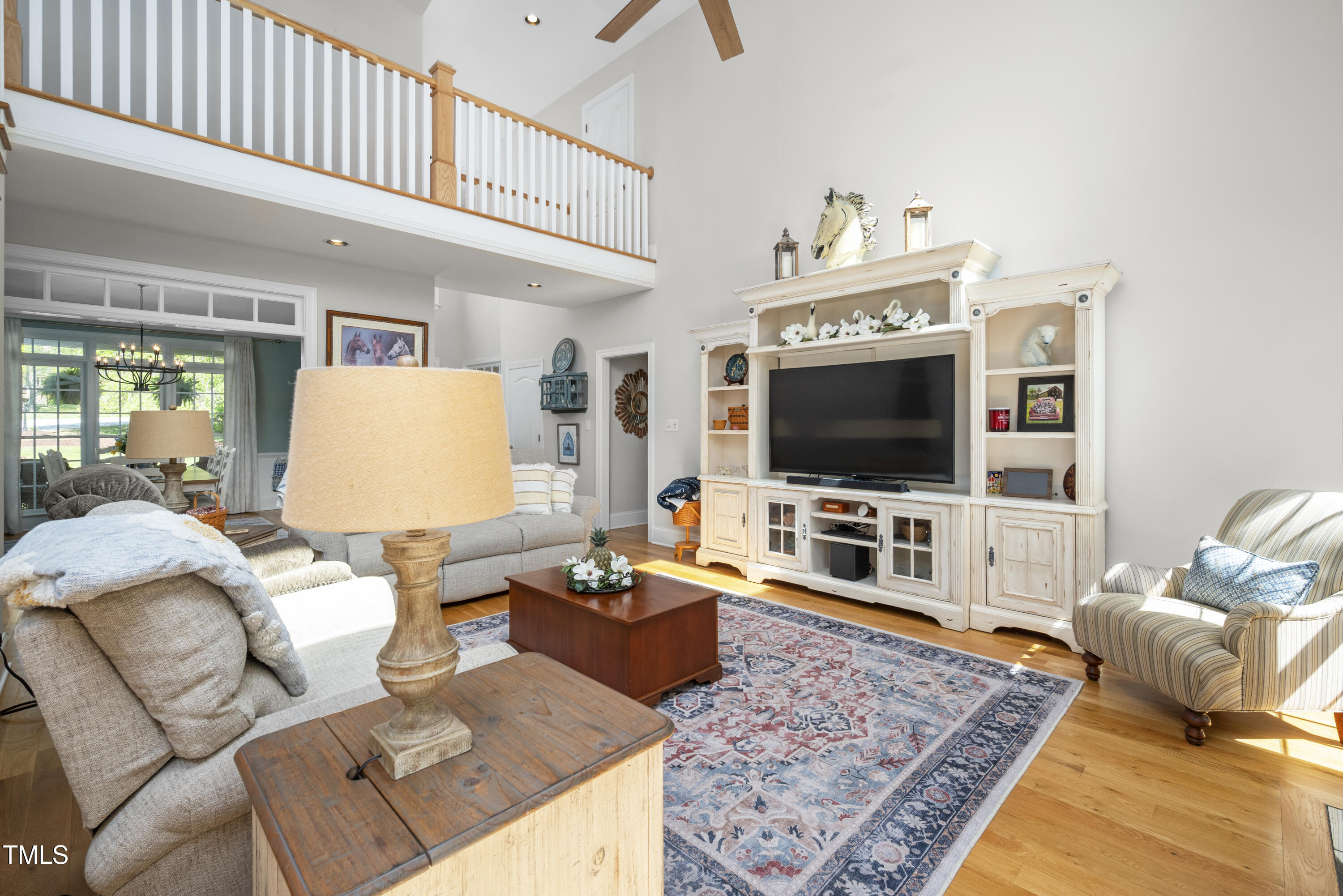 8480 Falkirk Ridge Court Wake Forest, NC 27587 - Photo 17 of 63 a living room with furniture and a flat screen tv