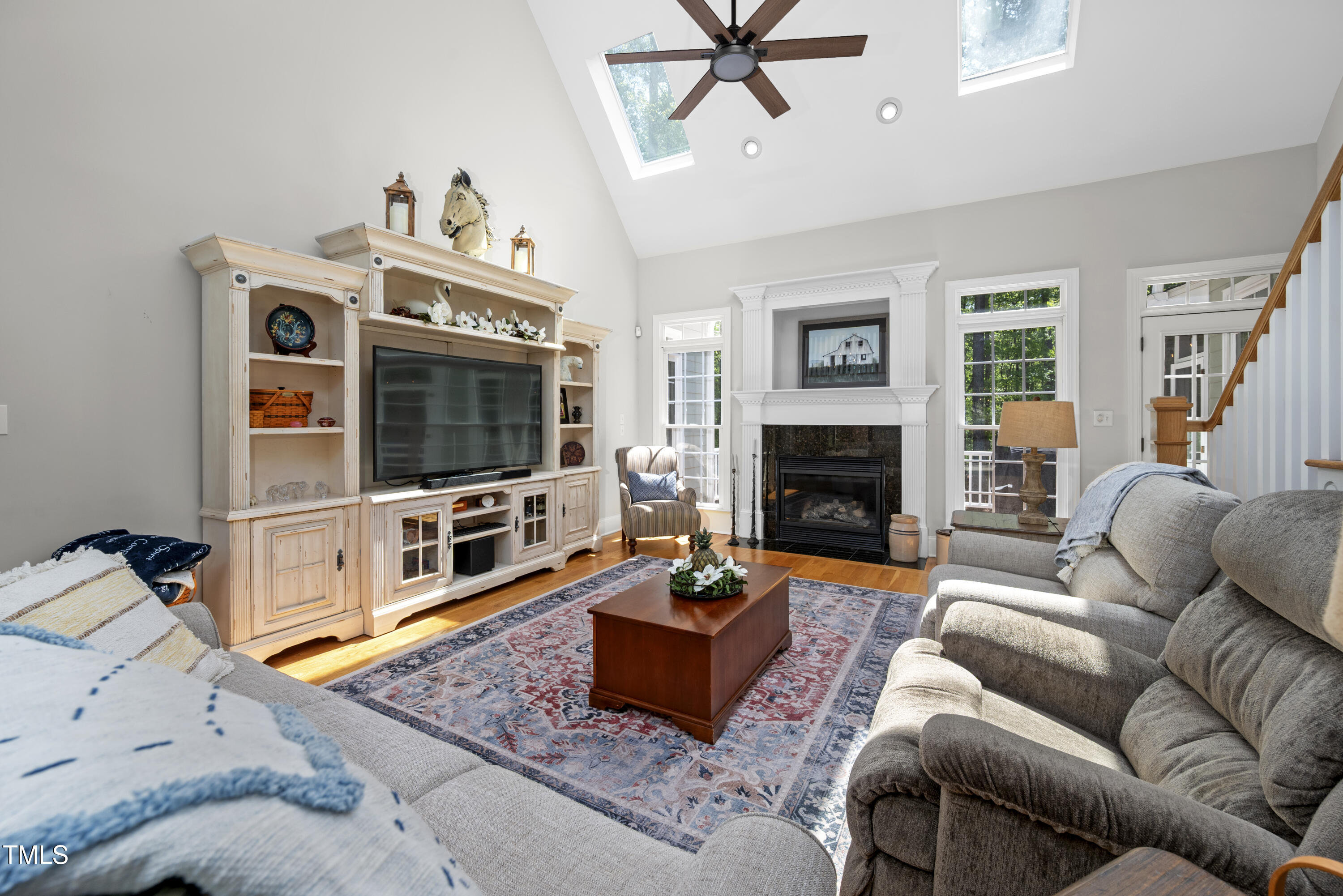 8480 Falkirk Ridge Court Wake Forest, NC 27587 - Photo 18 of 63 a living room with furniture and a flat screen tv