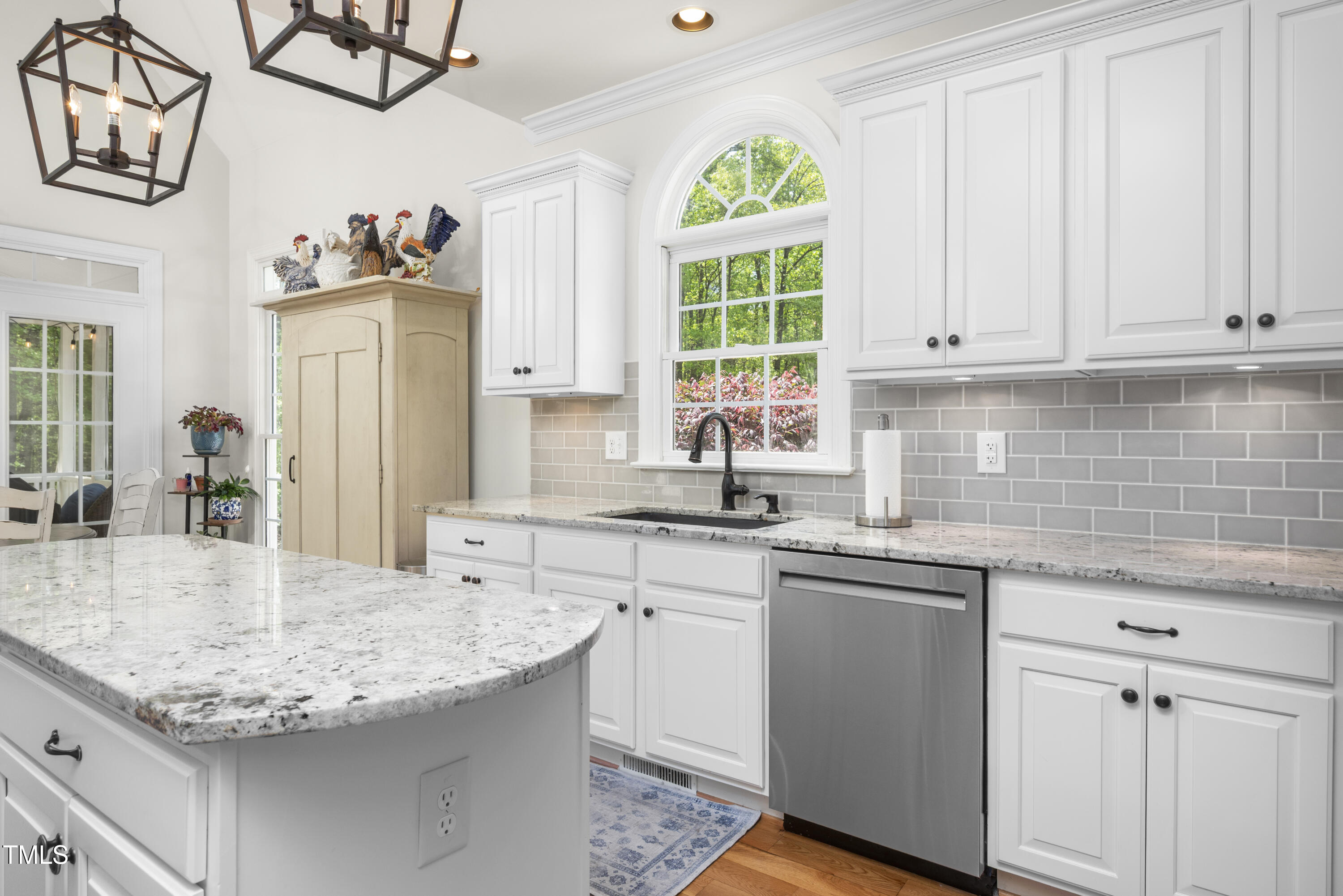 8480 Falkirk Ridge Court Wake Forest, NC 27587 - Photo 23 of 63 a kitchen with stainless steel appliances granite countertop a sink window and cabinets
