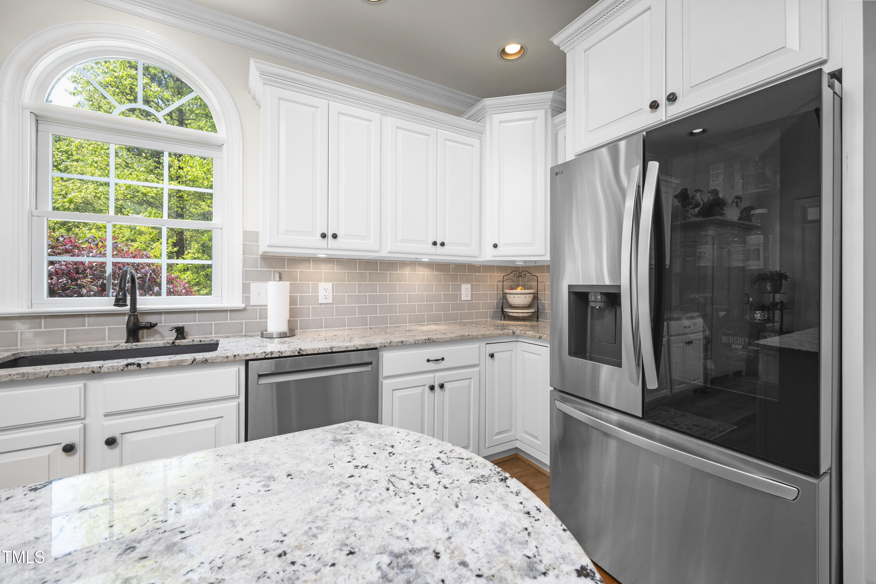 8480 Falkirk Ridge Court Wake Forest, NC 27587 - Photo 24 of 63 a kitchen with stainless steel appliances granite countertop a stove a refrigerator and a sink