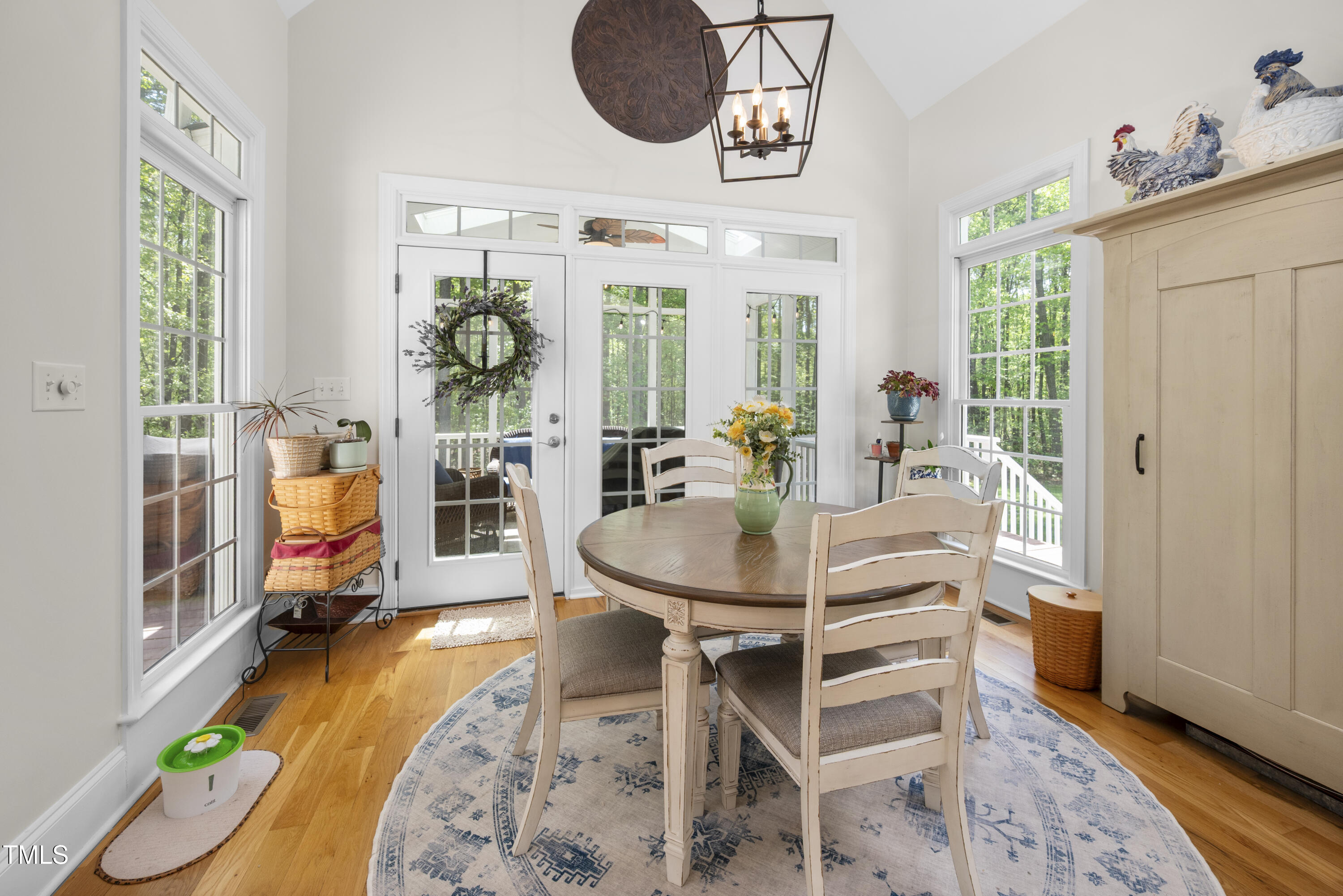 8480 Falkirk Ridge Court Wake Forest, NC 27587 - Photo 27 of 63 a view of a dining room with furniture window and wooden floor