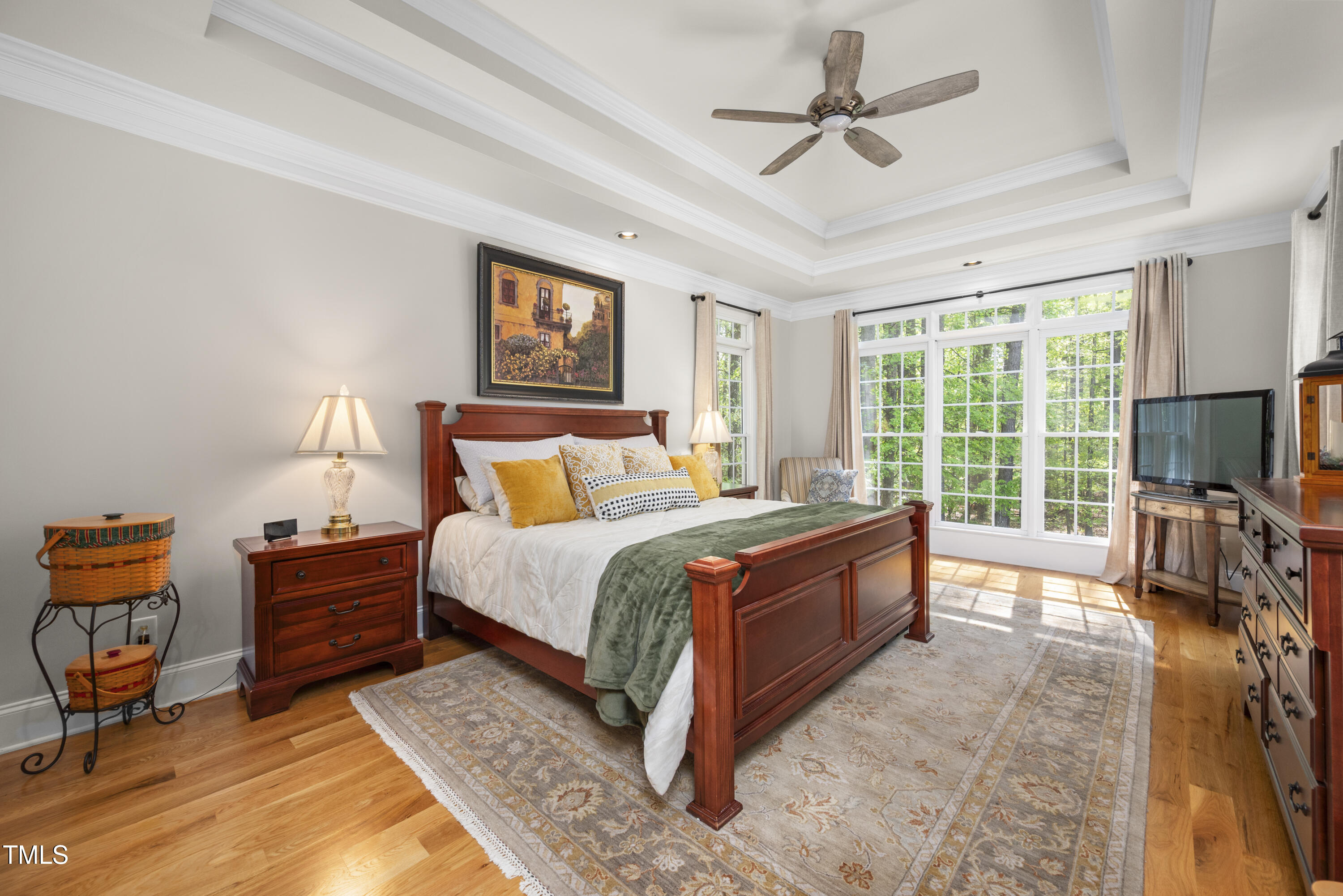 8480 Falkirk Ridge Court Wake Forest, NC 27587 - Photo 31 of 63 a spacious bedroom with a bed and a chandelier