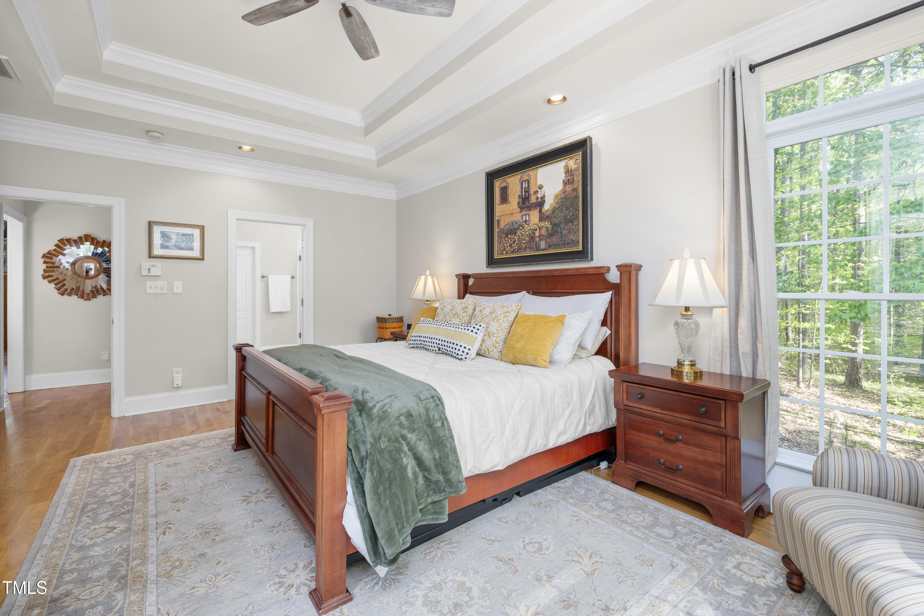 8480 Falkirk Ridge Court Wake Forest, NC 27587 - Photo 32 of 63 a bedroom with a bed a couch and a window