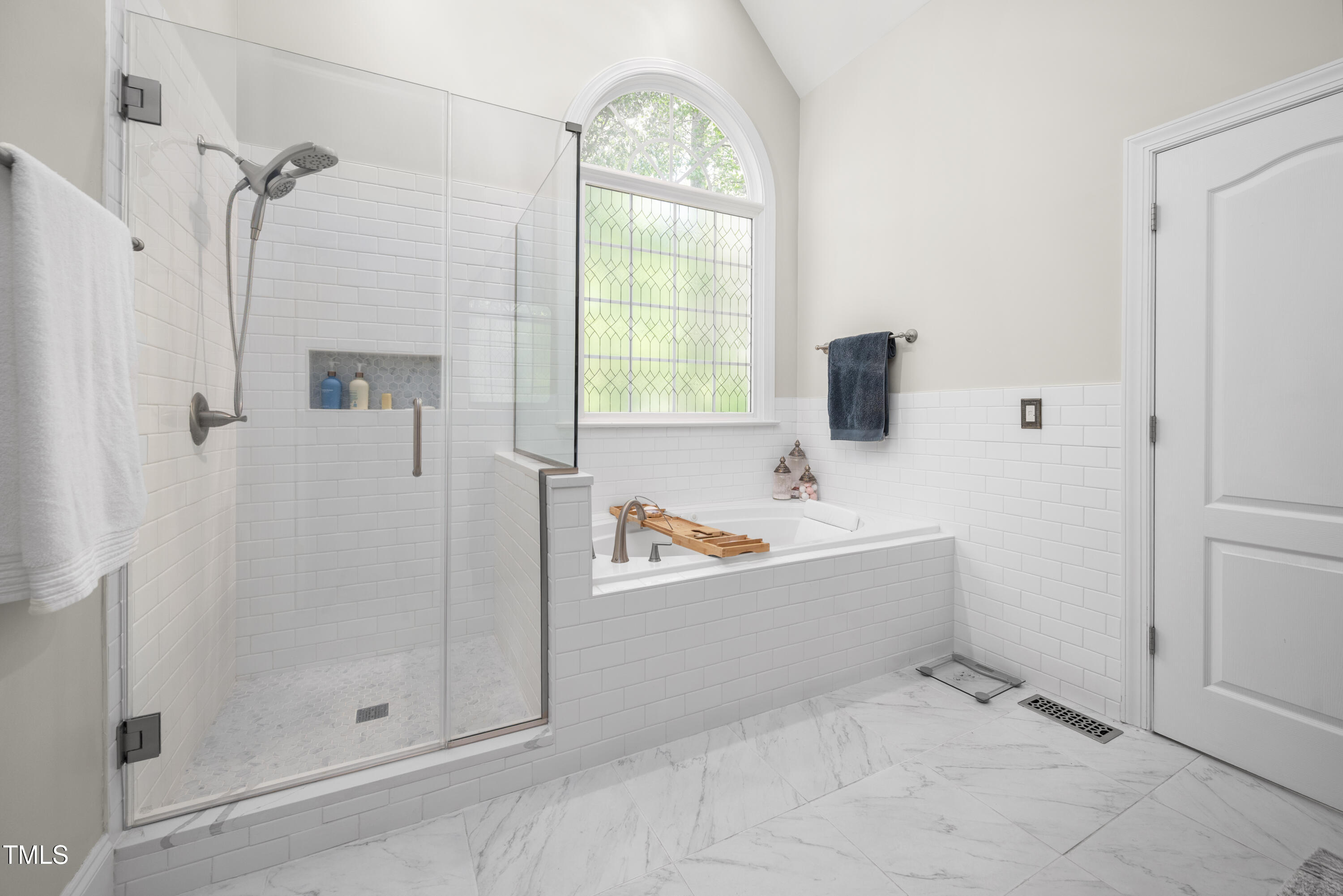 8480 Falkirk Ridge Court Wake Forest, NC 27587 - Photo 34 of 63 a bathroom with a bathtub and shower