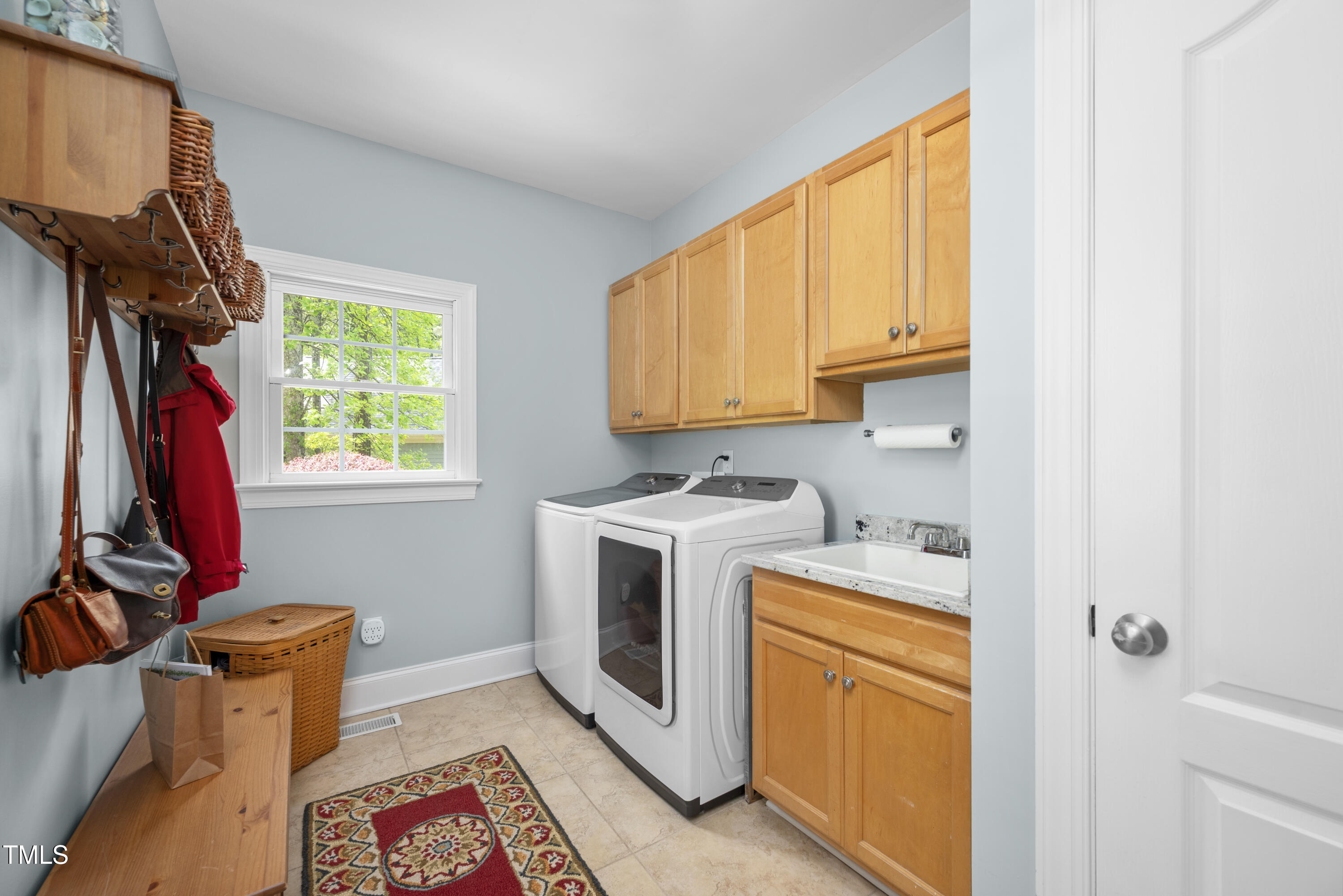 8480 Falkirk Ridge Court Wake Forest, NC 27587 - Photo 38 of 63 a view of storage and utility room with washer and dryer