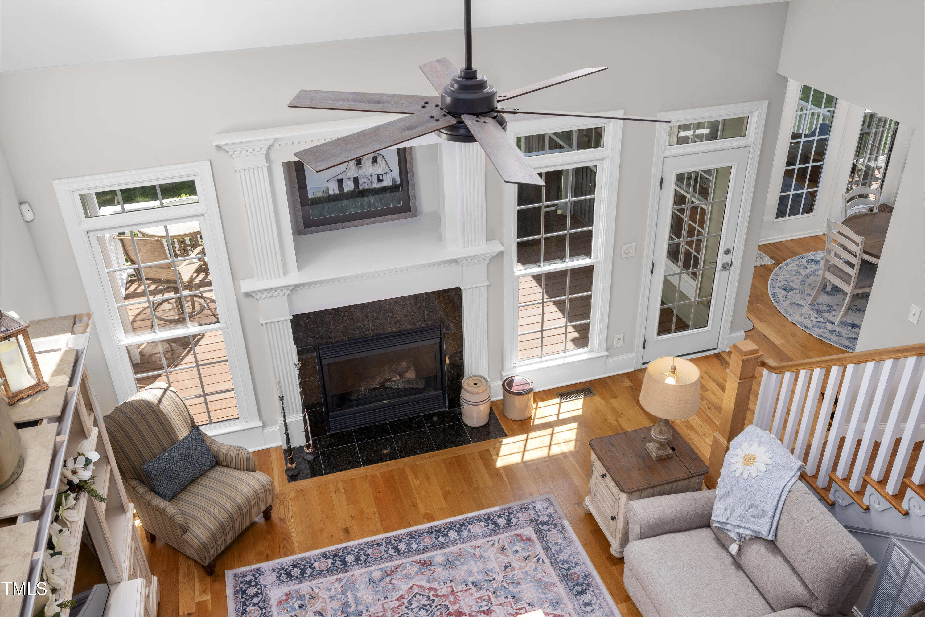 8480 Falkirk Ridge Court Wake Forest, NC 27587 - Photo 42 of 63 a living room with furniture a flat screen tv and a fireplace