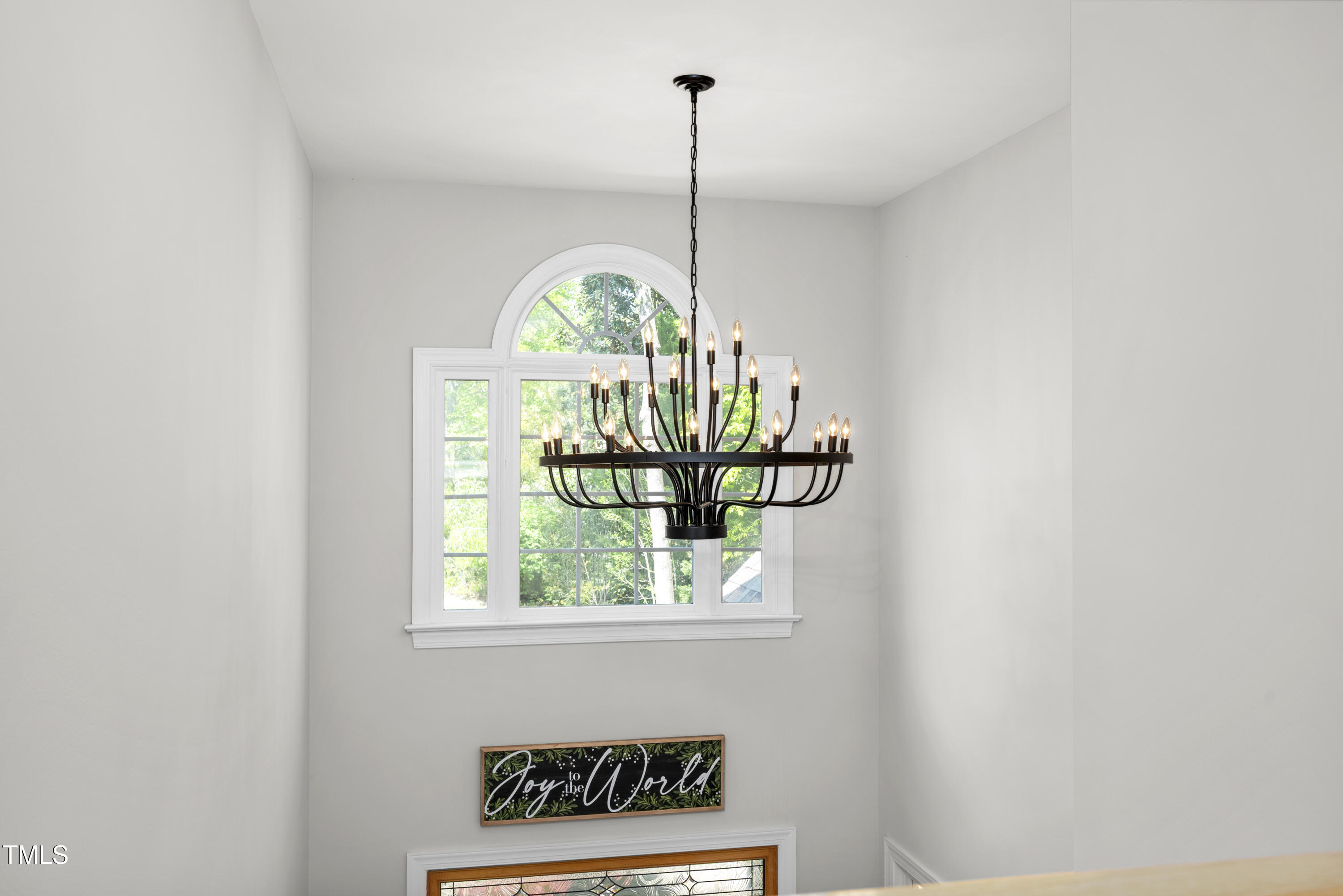 8480 Falkirk Ridge Court Wake Forest, NC 27587 - Photo 43 of 63 a kitchen with a window a chandelier stainless steel appliances and a window