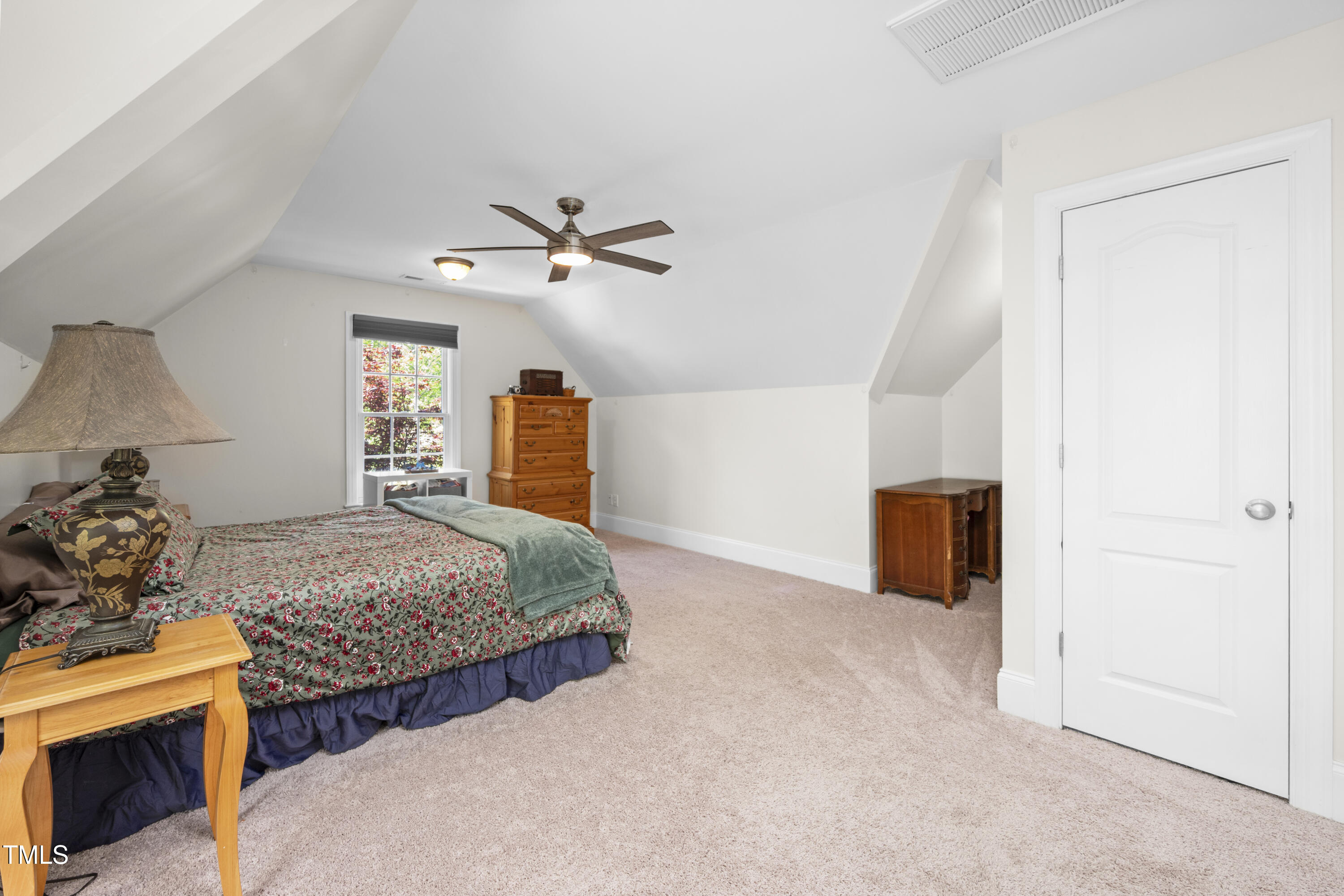 8480 Falkirk Ridge Court Wake Forest, NC 27587 - Photo 46 of 63 a bedroom with two beds and a chandelier