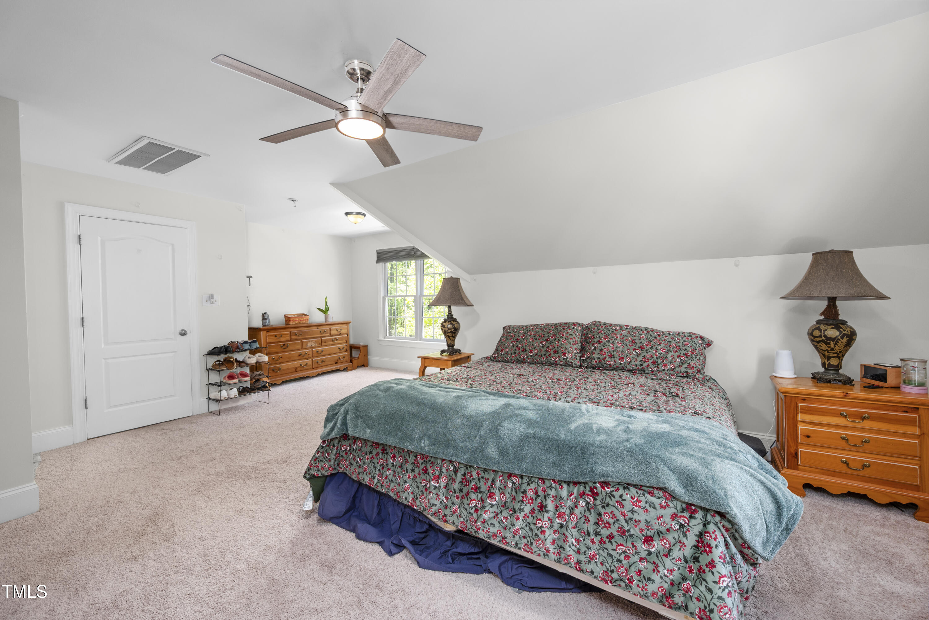 8480 Falkirk Ridge Court Wake Forest, NC 27587 - Photo 47 of 63 a bedroom with a bed and window