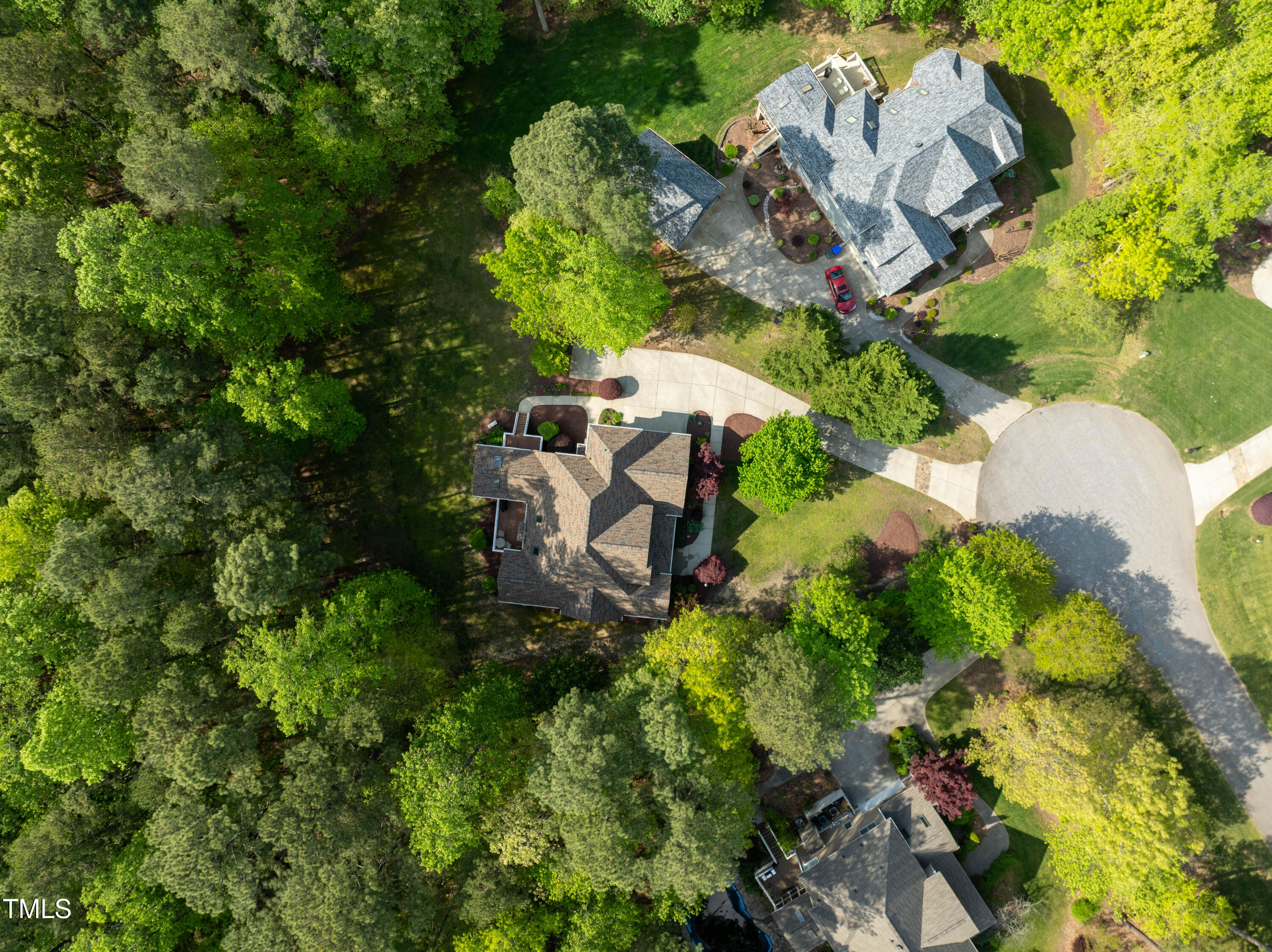 8480 Falkirk Ridge Court Wake Forest, NC 27587 - Photo 51 of 63 an aerial view of a house with a yard and greenery