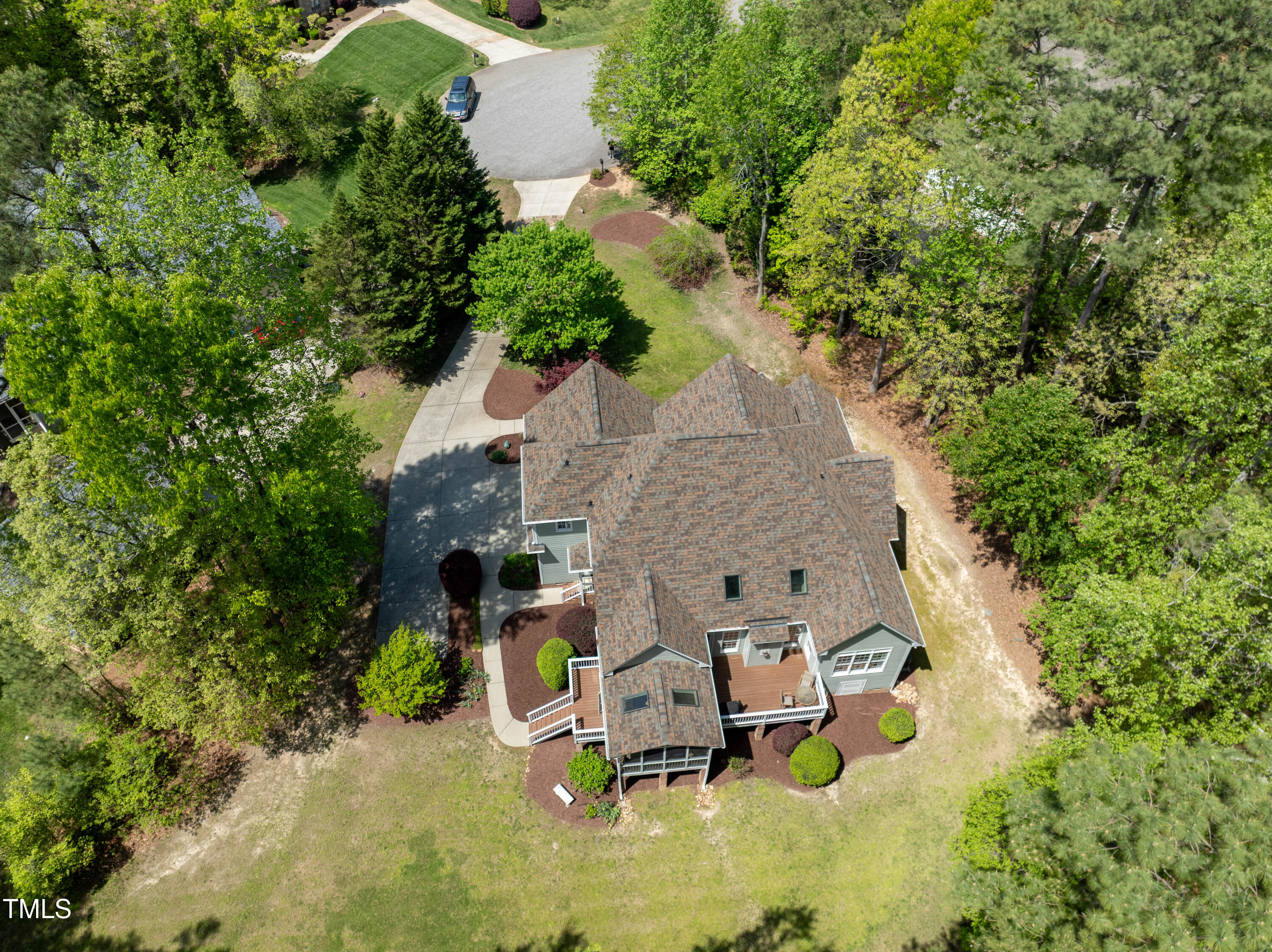 8480 Falkirk Ridge Court Wake Forest, NC 27587 - Photo 53 of 63 an aerial view of a house with swimming pool and large trees