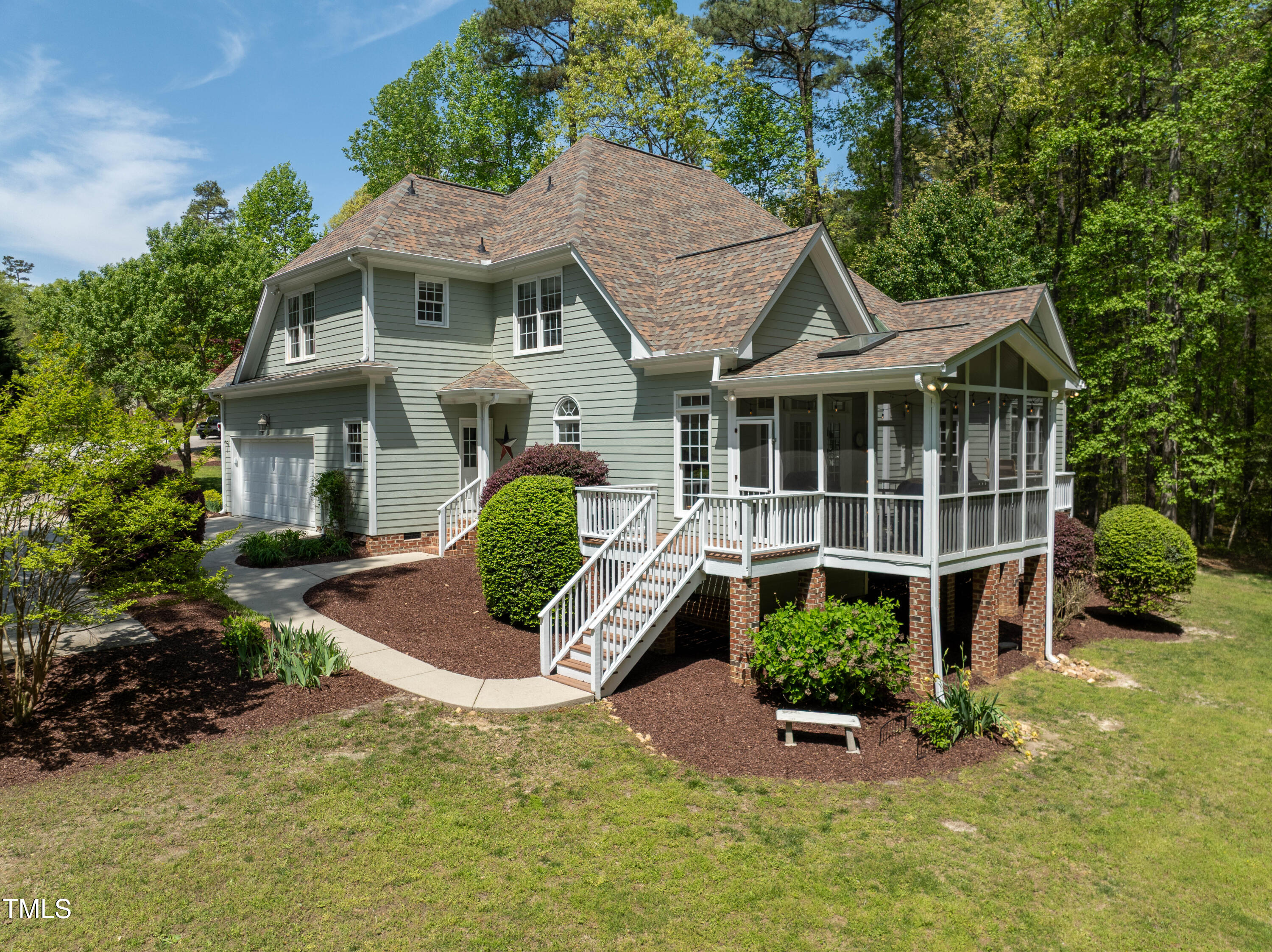 8480 Falkirk Ridge Court Wake Forest, NC 27587 - Photo 57 of 63 a front view of a house with a yard and potted plants