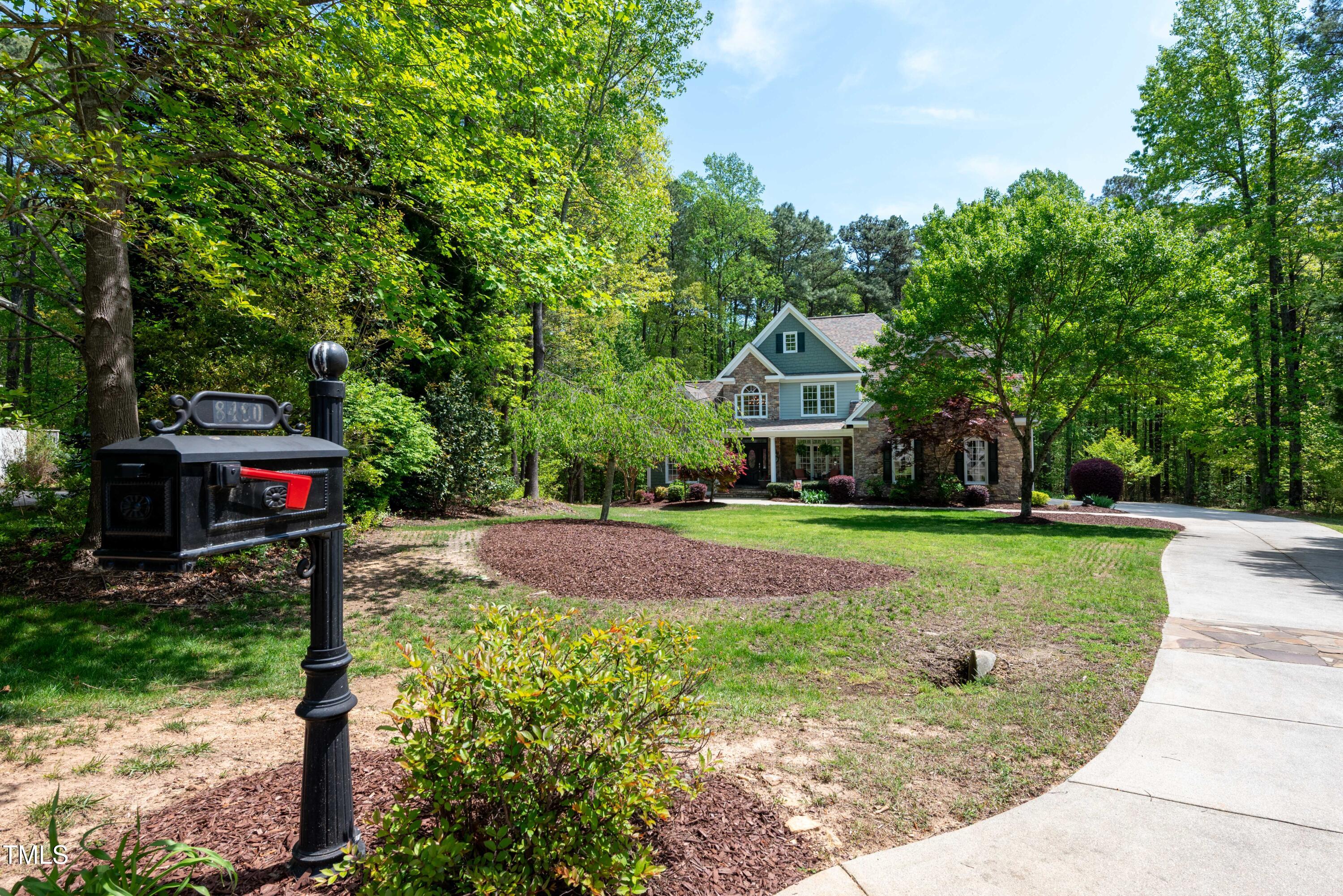 8480 Falkirk Ridge Court Wake Forest, NC 27587 - Photo 58 of 63 a front view of a house with a garden