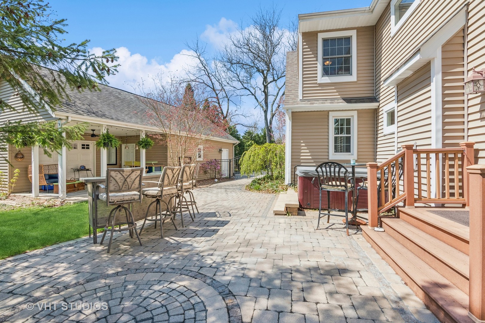 59 2s283 Route Warrenville, IL 60555 - Photo 14 of 49 a view of a patio with table and chairs and potted plants