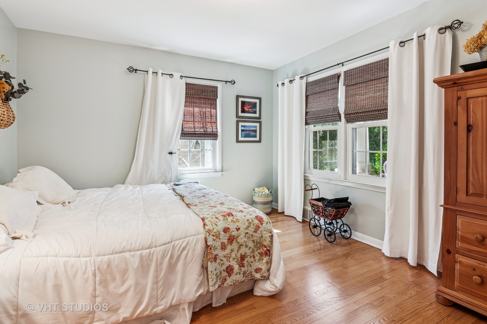 59 2s283 Route Warrenville, IL 60555 - Photo 30 of 49 a bedroom with a bed and a table in it