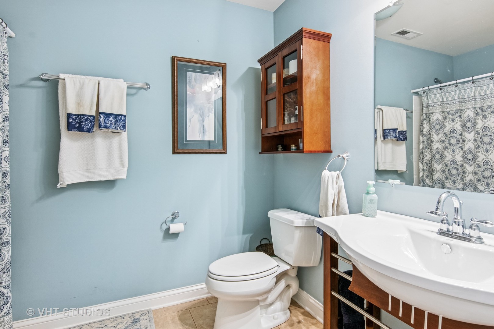 59 2s283 Route Warrenville, IL 60555 - Photo 36 of 49 a bathroom with a toilet sink and mirror
