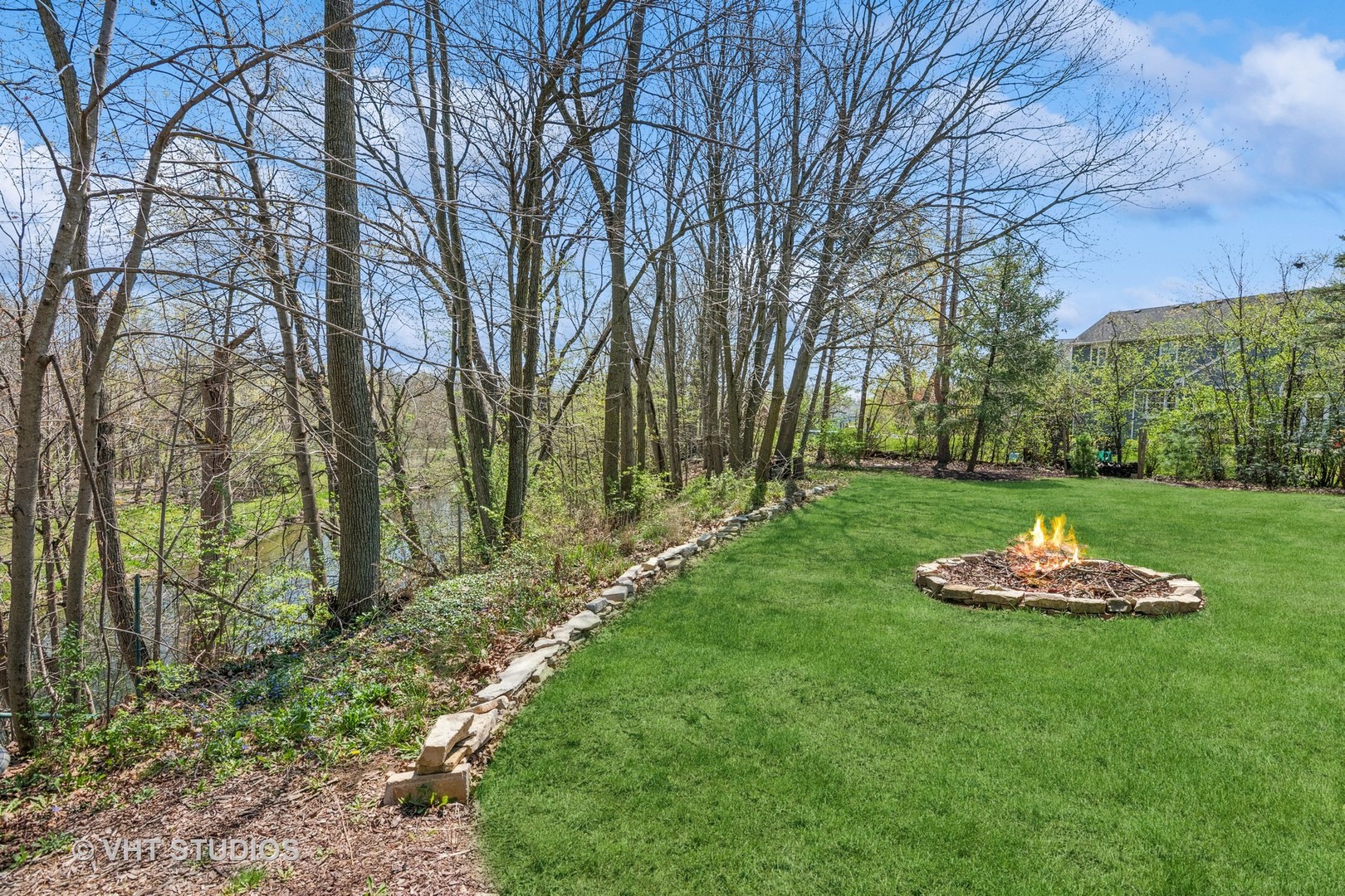 59 2s283 Route Warrenville, IL 60555 - Photo 10 of 49 a view of a table and chairs in a garden