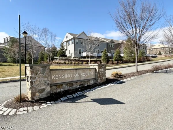 a view of a street with a building in the background