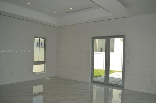 a view of a hallway with a chandelier