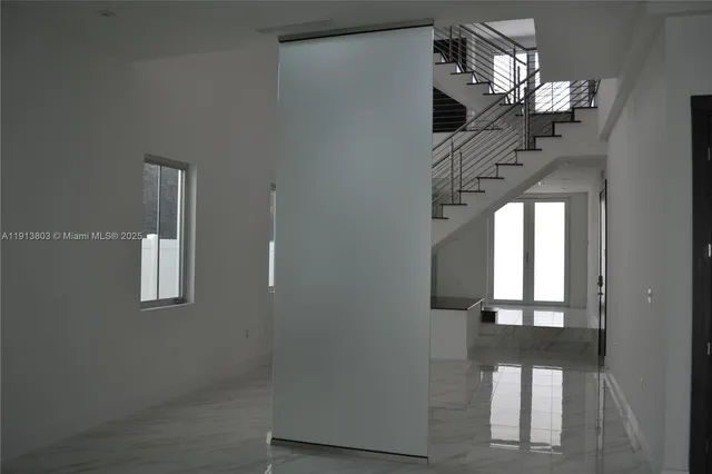 a view of a hallway with windows