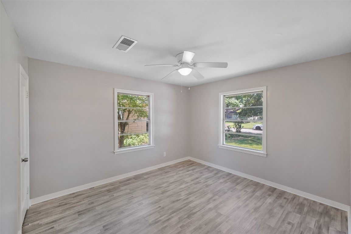 8527 Brower Street Houston, TX 77017 - Photo 11 of 19 a view of an empty room with a window and wooden floor
