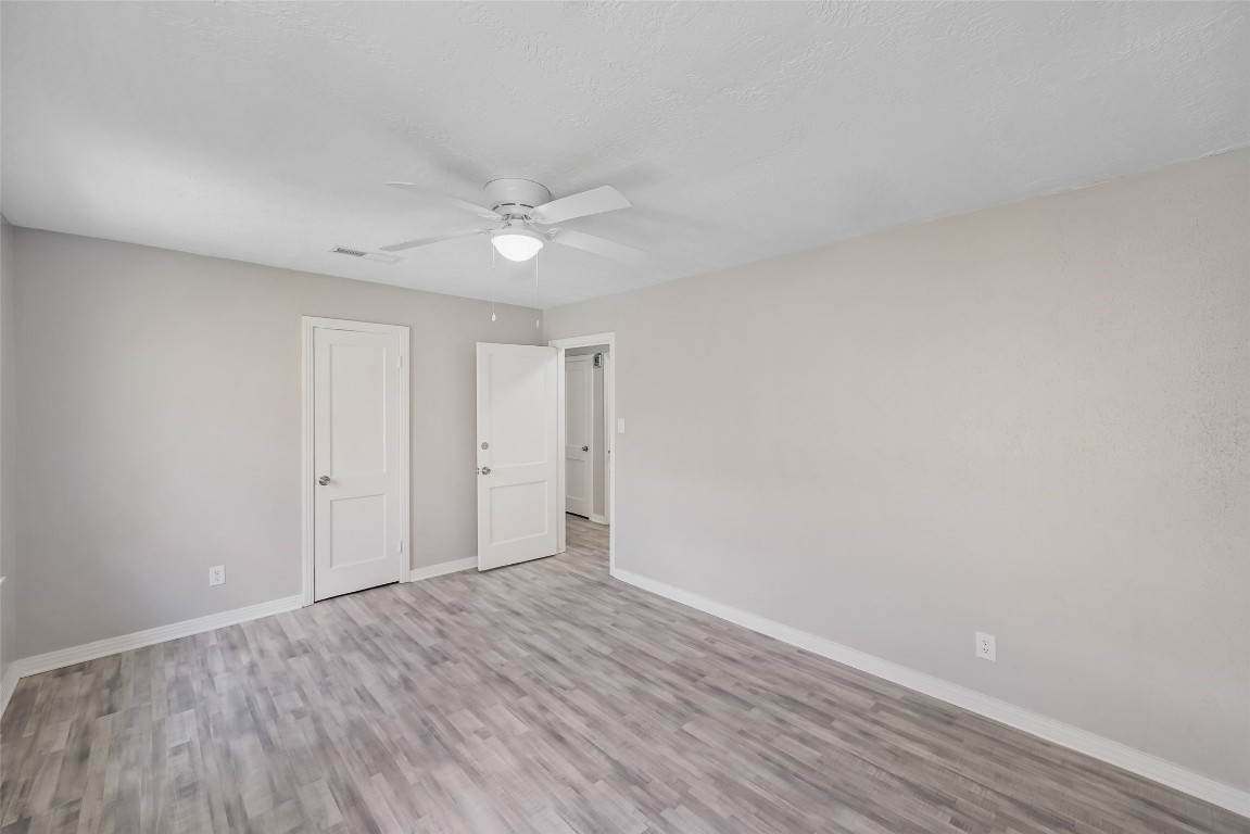 8527 Brower Street Houston, TX 77017 - Photo 13 of 19 a view of an empty room with wooden floor