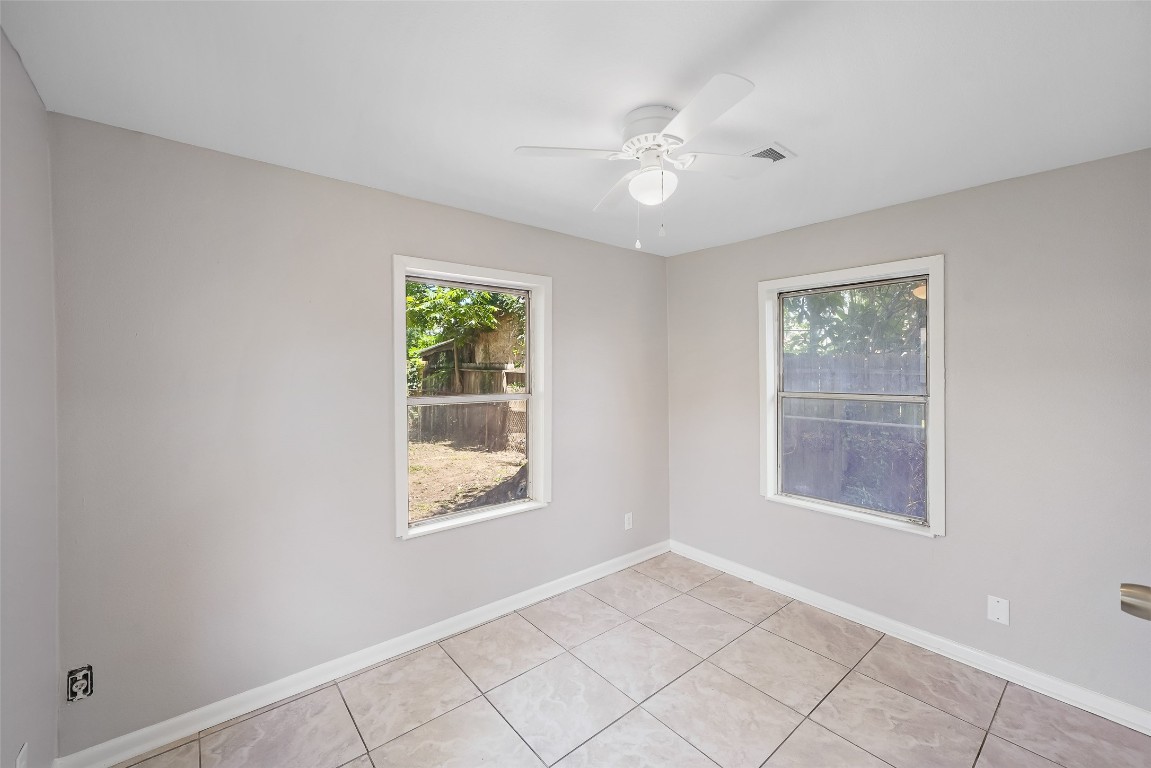 8527 Brower Street Houston, TX 77017 - Photo 15 of 19 a view of an empty room with window and chandelier fan